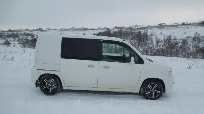 Бежевый Honda capa